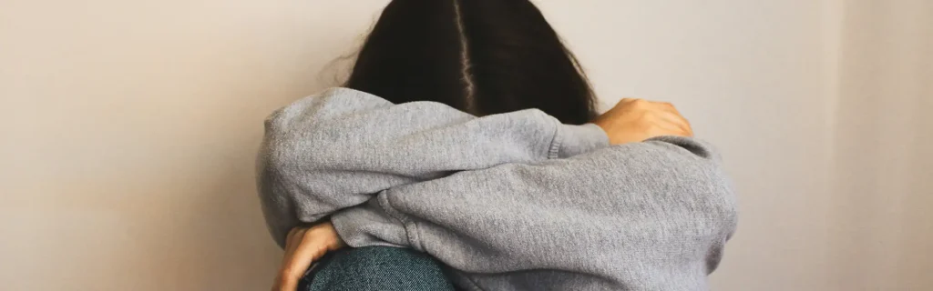 lady with head on knees